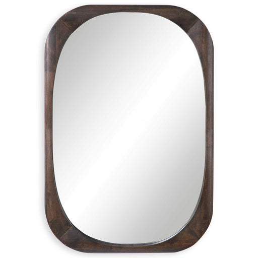 Dark brown Sheldon mid-century wall mirror by Uttermost with a sleek, modern frame hanging on a wall.