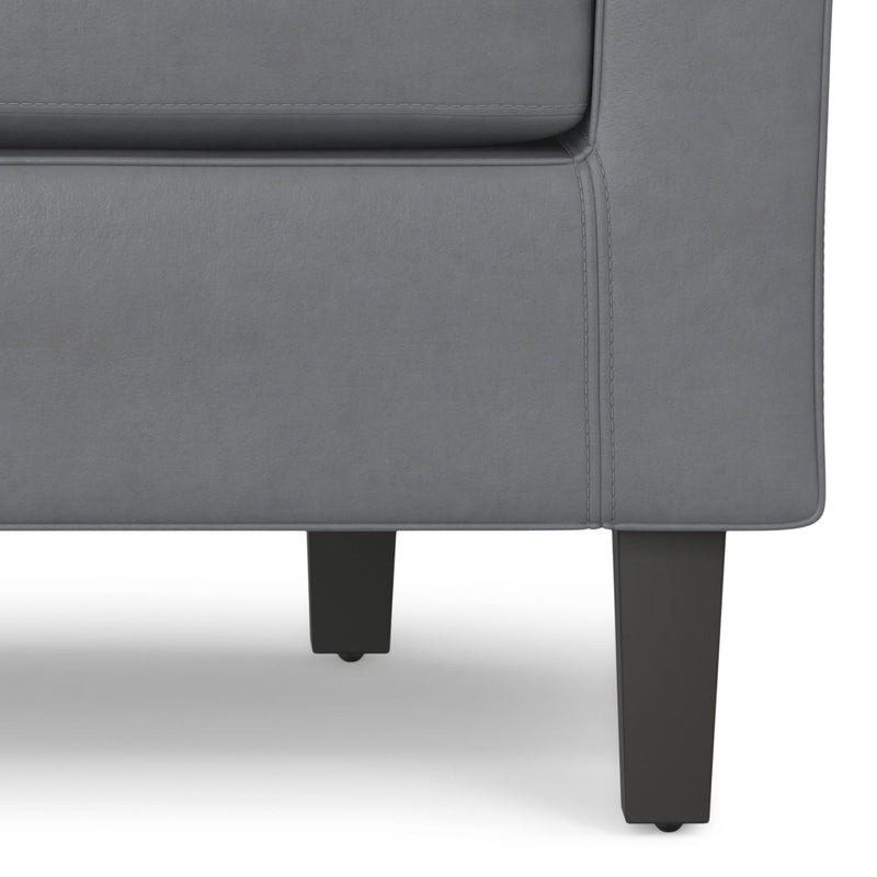 Austin transitional arm chair by Simpli-Home with plush fabric upholstery and wooden legs, showcasing a stylish and comfortable design.
