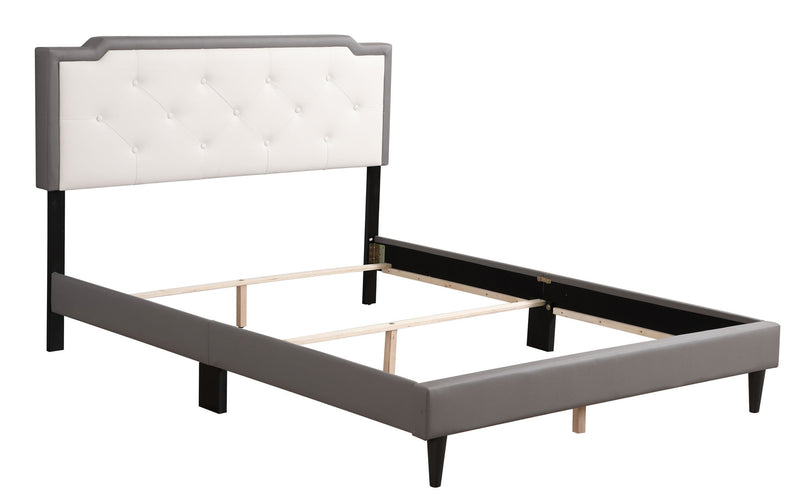 Two-tone upholstered bed from Glory Furniture, showcasing a modern, padded headboard and sleek design in a cozy bedroom setting.