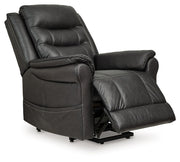 Signature Design by Ashley Oatman Power Lift Recliner in plush fabric with padded armrests and a reclining mechanism.