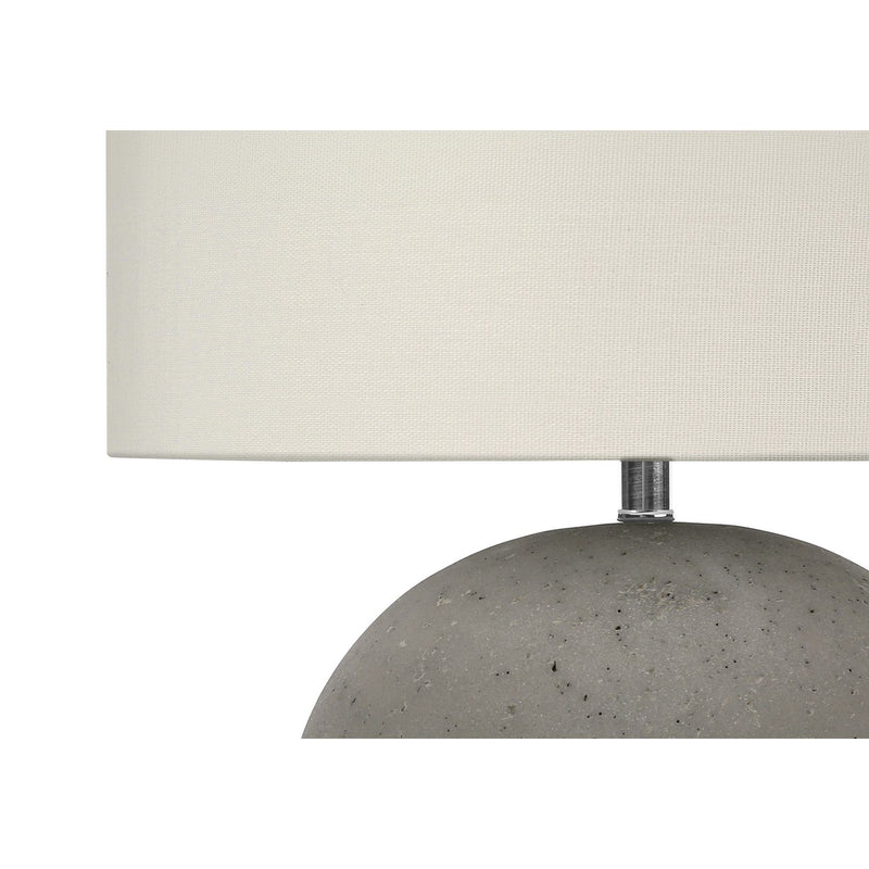 Contemporary gray and cream concrete table lamp by 8th Street, featuring a minimalist design and cylindrical shape.