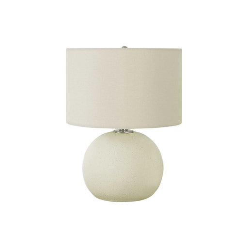 Cream ceramic contemporary table lamp by 8th Street with a sleek modern design and a warm, inviting glow.