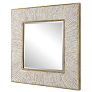 Uttermost Wharton square gold accent mirror with a sleek, modern frame, hanging on a wall in a contemporary setting.