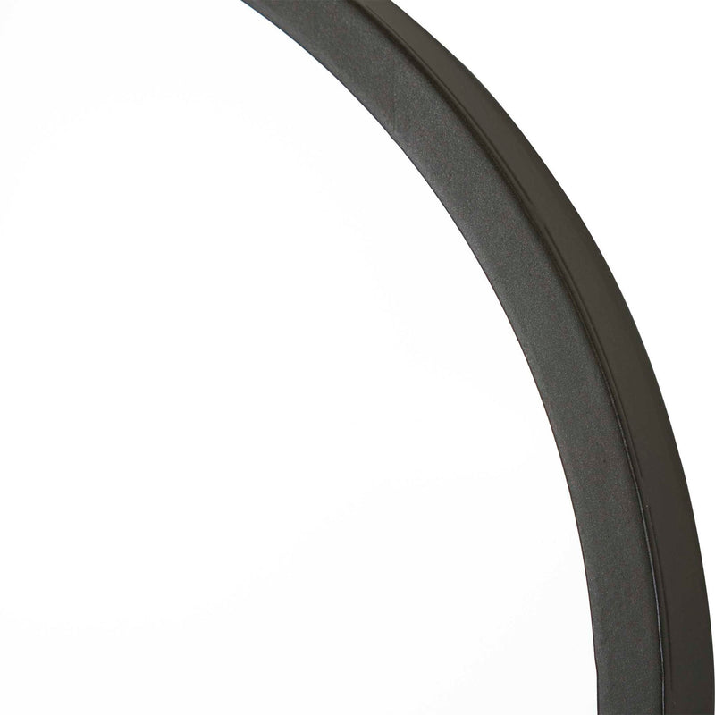 Uttermost Taft wall mirror with a sleek, modern frame, reflecting a stylish interior design.
