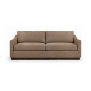 Classic Home Aspen stationary sofa with plush cushions and sleek design, shown in a modern living room setting.