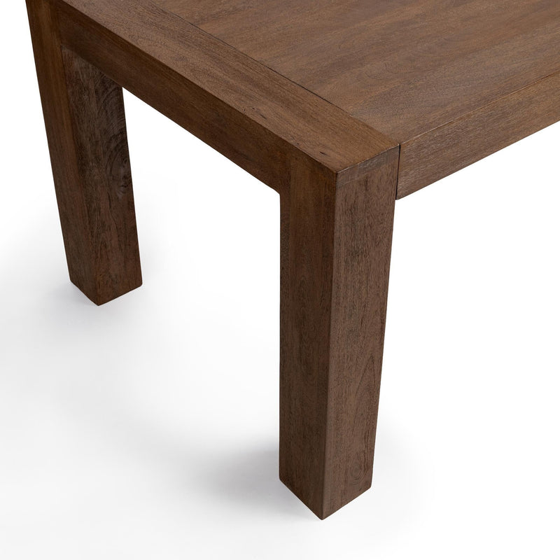Classic Home Glendale dining table in toasted chestnut finish, showcasing a spacious wooden surface and sturdy legs.