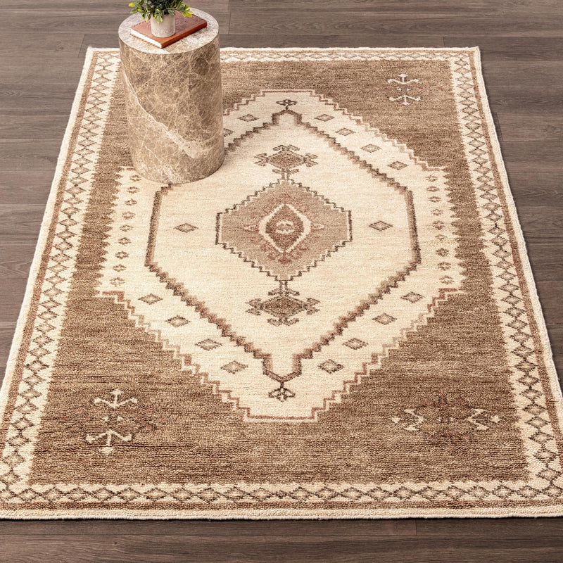Classic Home Luxor hand-knotted area rug with intricate geometric patterns in warm earthy tones.