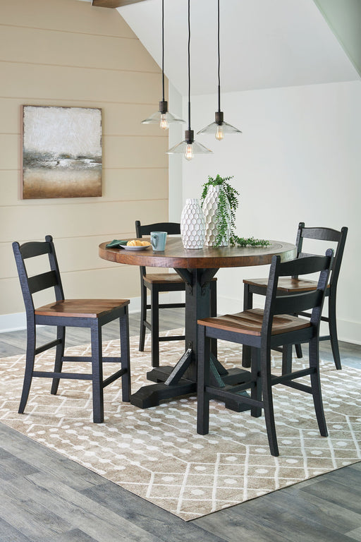 Signature Design by Ashley Valebeck 4-piece counter height dining room set with table and four chairs in a modern finish.