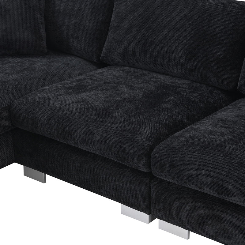 Luxe & Co. Modern L-shaped cloud sectional sofa with oversized chaise, four seats, and two decorative pillows in a stylish living room setting.