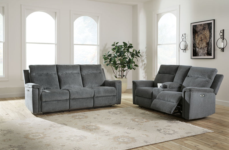 Signature Design by Ashley Barnsana reclining sofa and loveseat set in a modern living room with plush cushions and neutral upholstery.