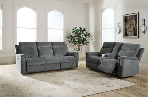 Signature Design by Ashley Barnsana reclining sofa and loveseat set in a modern living room with plush cushions and neutral upholstery.