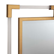 Uttermost Balkan iron wall mirror with a round, decorative metal frame reflecting light in a modern interior setting.