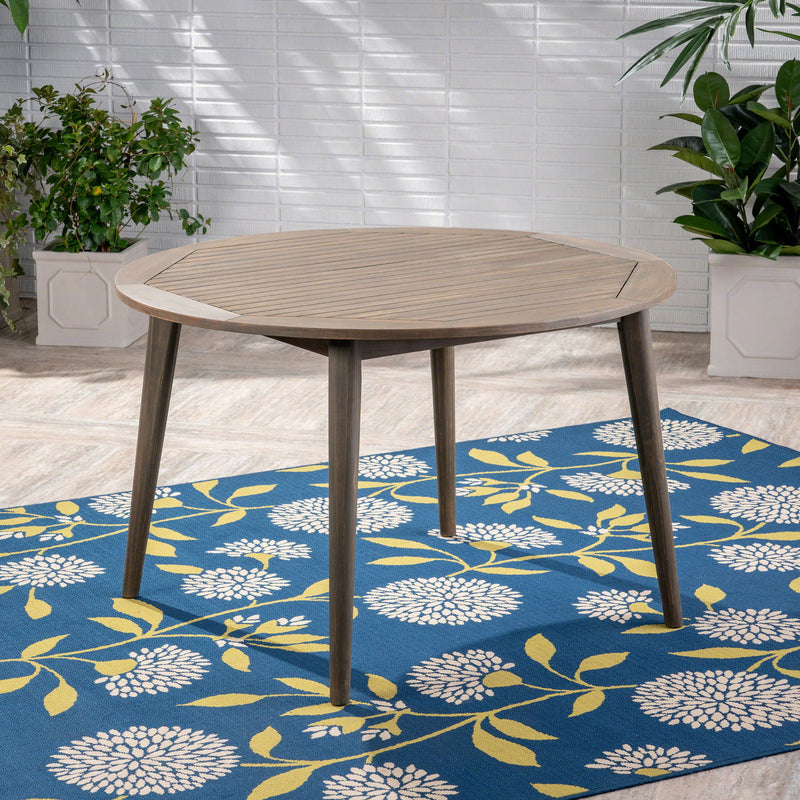 Modern Noble House Stamford outdoor dining table with sleek design, featuring a spacious surface for outdoor meals.