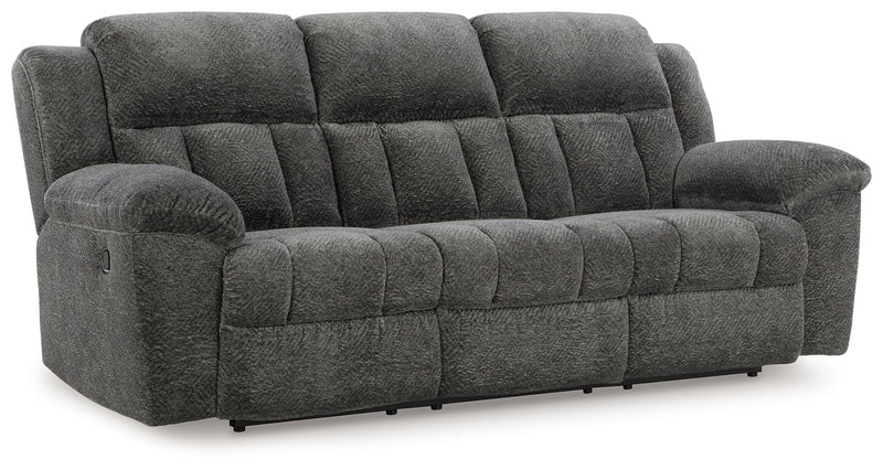Reclining sofa and loveseat set by Signature Design by Ashley, featuring plush fabric and comfortable seating in a modern living room.