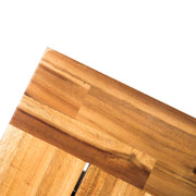 Black outdoor teak dining bench from Noble House, backless patio bench suitable for outdoor seating and garden decor.