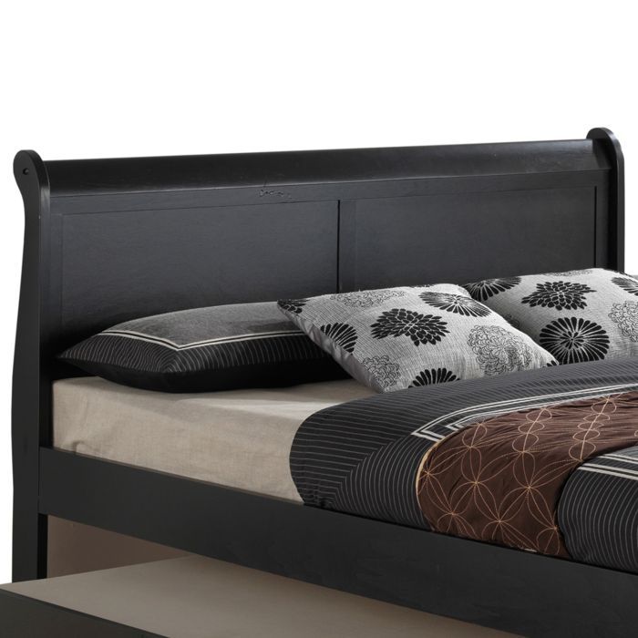 Elegant Glory Furniture trundle bed with classic design, showcasing a wooden frame and pull-out sleeping drawer for space-saving comfort.