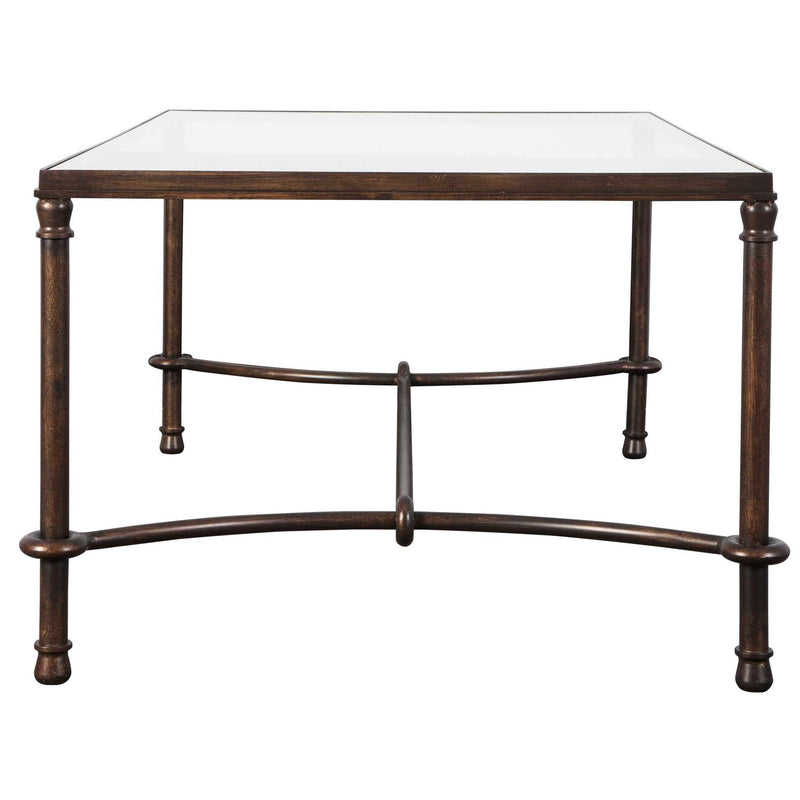 Uttermost Warring Iron Coffee Table with round metal top and industrial-style legs, modern design for living room decor.