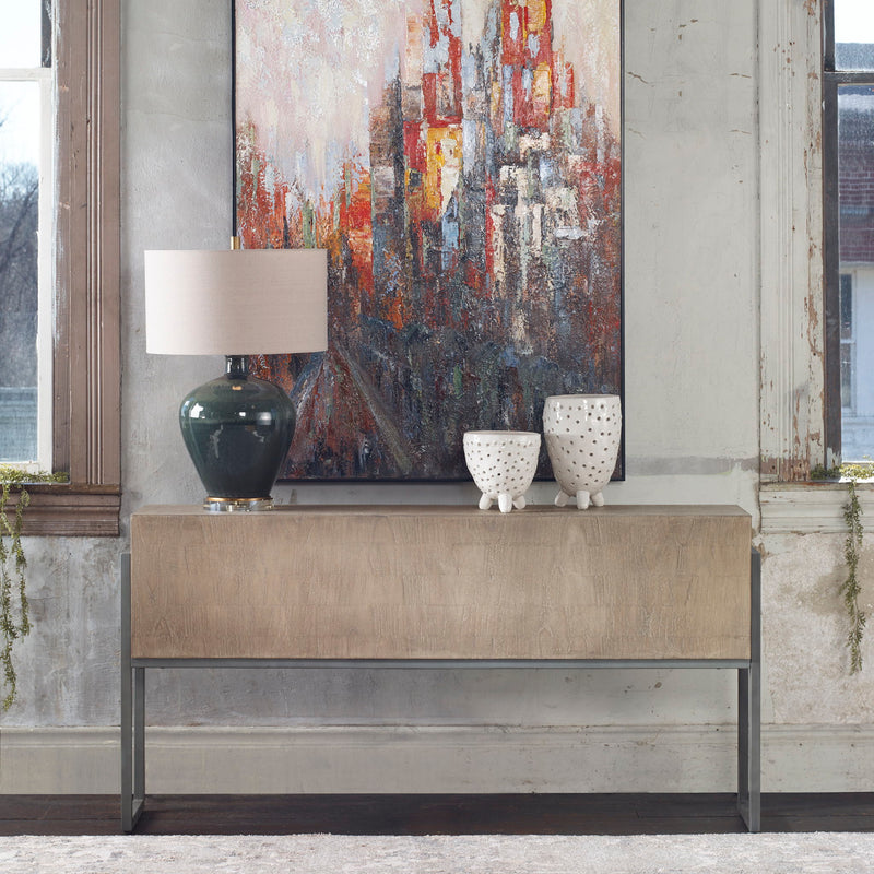 Contemporary Nevis console table by Uttermost with light brown finish and sleek modern design for living or entryway spaces.