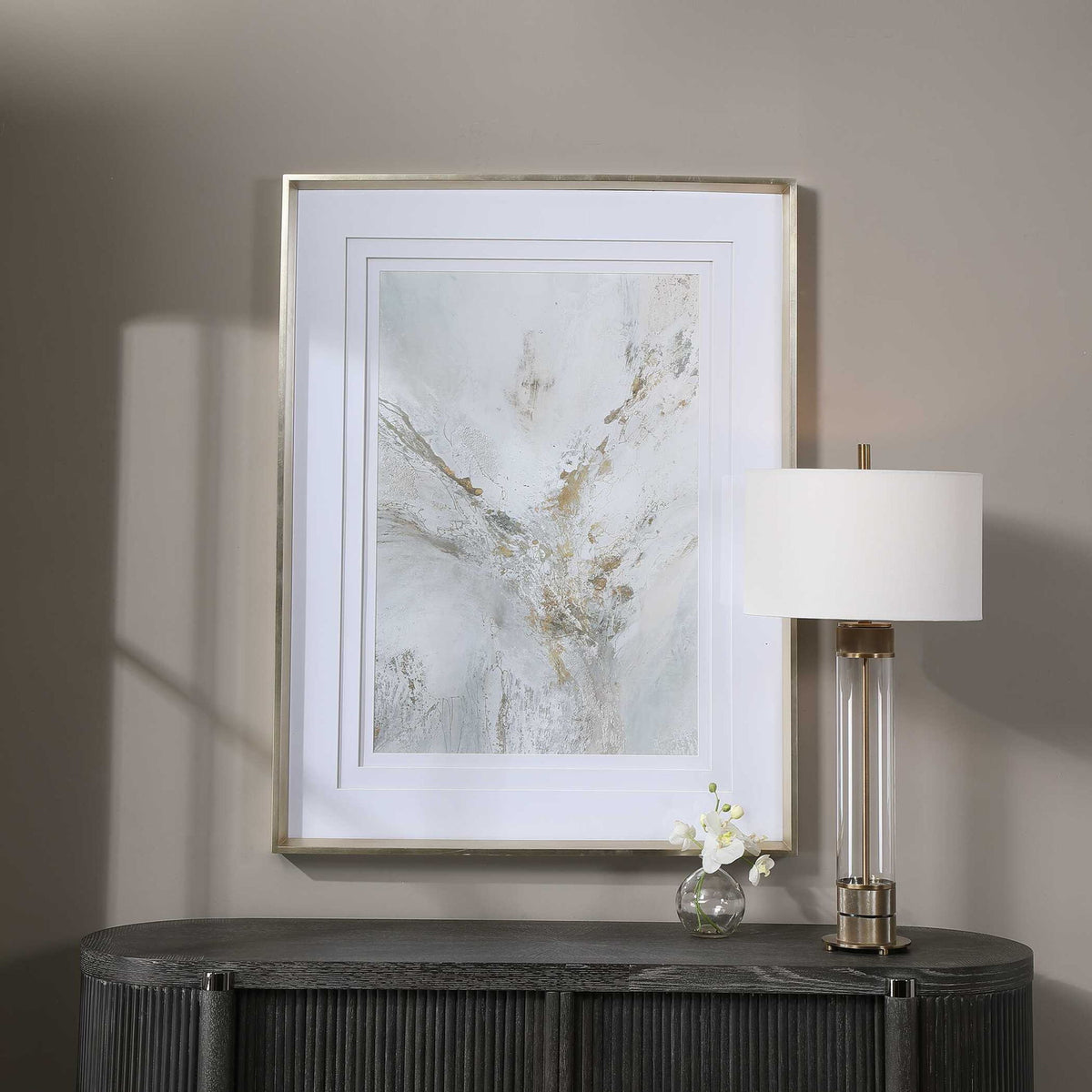 Framed abstract print by Uttermost with gold accents, modern wall art in a sleek frame.