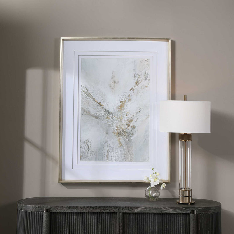 Framed abstract print by Uttermost with gold accents, modern wall art in a sleek frame.