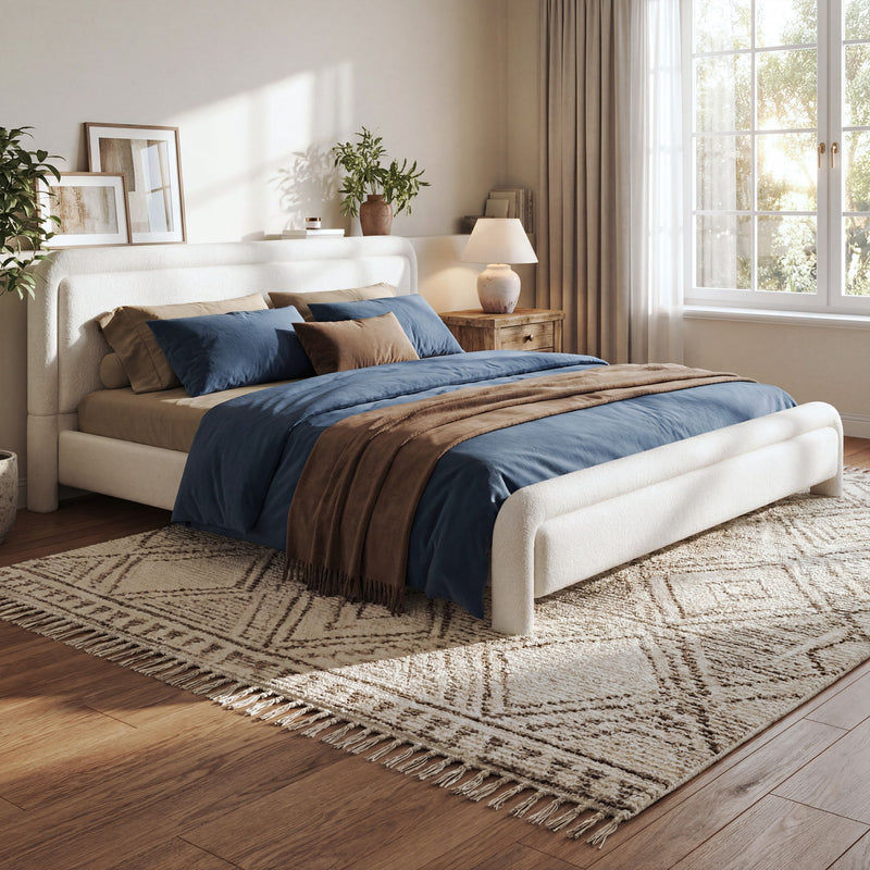 Artistry At Home upholstered platform bed frame with curved headboard and wood slats support, showcasing soft fabric upholstery and modern design.