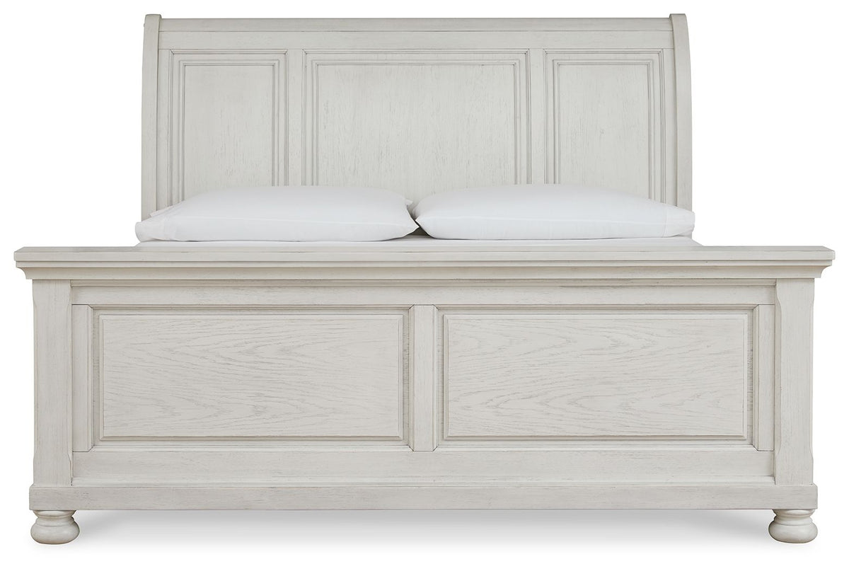 Robbinsdale Signature Design by Ashley sleigh storage bed with wooden finish and built-in under-bed storage drawers.