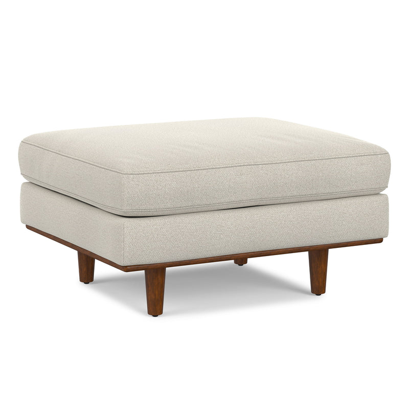 Simpli-Home Morrison handcrafted upholstered ottoman with fabric-covered top and wooden legs, versatile and stylish for living room decor.