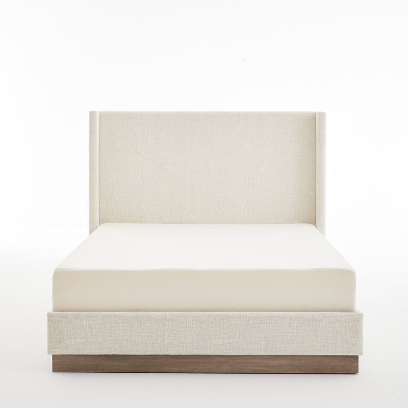 House & Home Furniture Hosford minimalist upholstered wingback bed with wood platform base, shown in a modern bedroom setting.