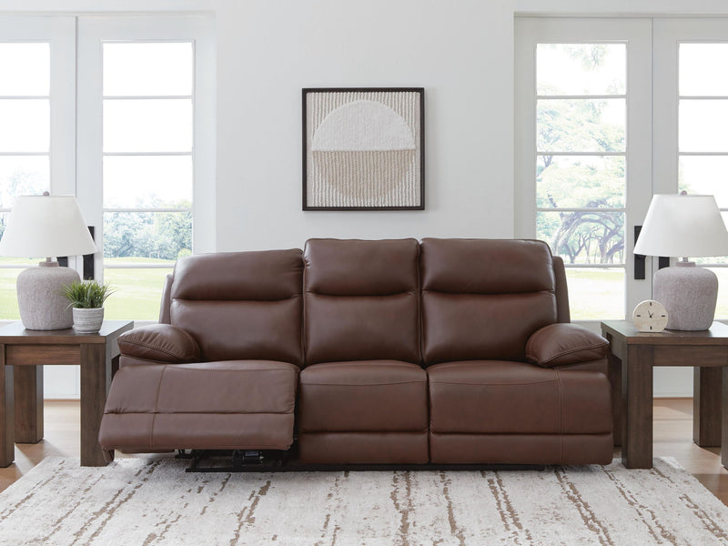 Signature Design by Ashley Vonryan power reclining sofa with adjustable headrest in tobacco leather, showing plush cushions and sleek design.