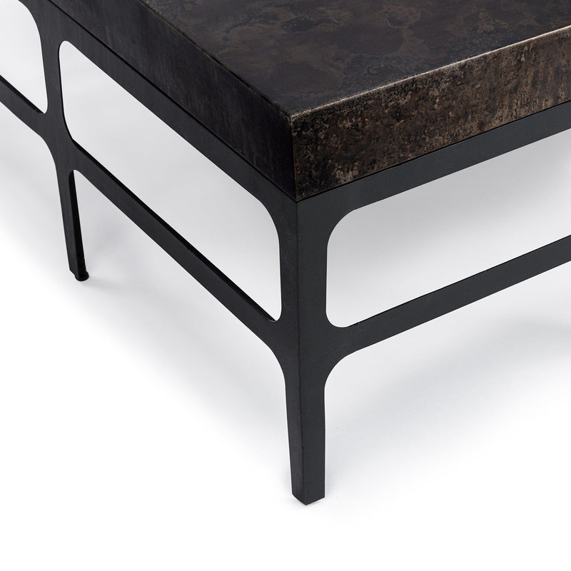 Rust Noir Adela coffee table by Classic Home featuring a sleek design and modern style in a close-up view.