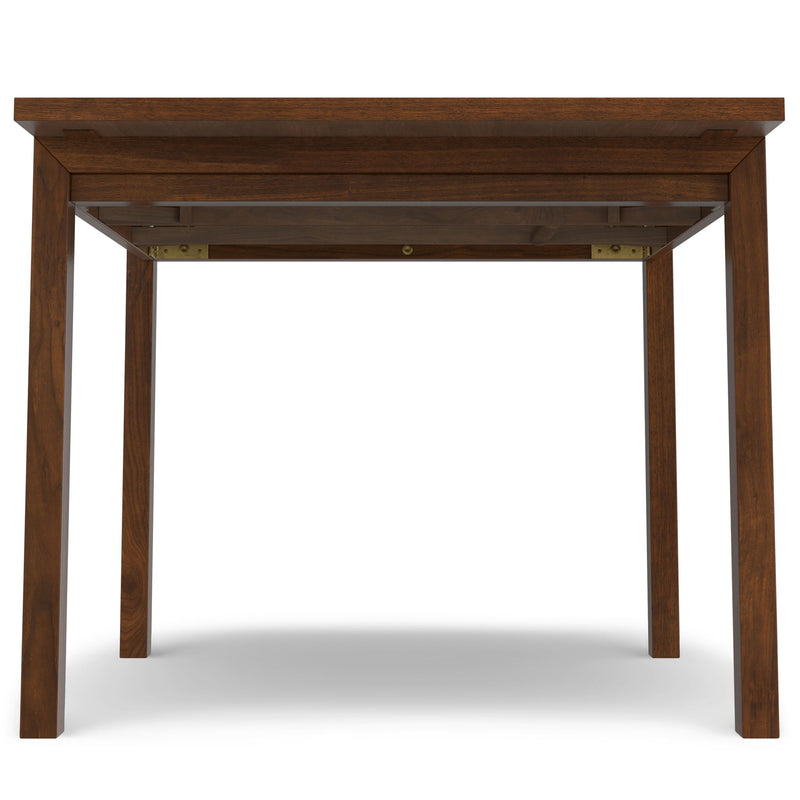 Wilson handcrafted dining table by Simpli-Home featuring a wooden surface and sturdy legs in a modern design.