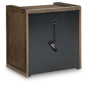 Brown Benchcraft Marxmore three-drawer nightstand with built-in charging station and sleek modern design.