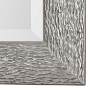 Silver Mossley metallic wall mirror by Uttermost with a round, reflective surface and a sleek, modern frame design.