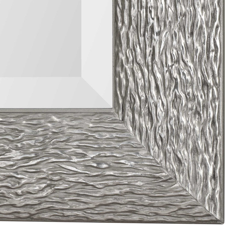 Silver Mossley metallic wall mirror by Uttermost with a round, reflective surface and a sleek, modern frame design.