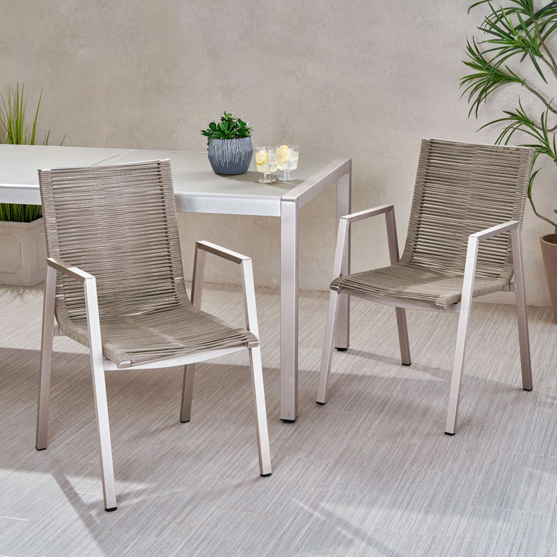 Set of two Noble House outdoor modern aluminum dining chairs with rope sea accents, featuring sleek frames and woven seat details.