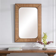 Light brown rattan wall mirror from Uttermost's Tahiti collection, featuring a round frame and natural woven design.