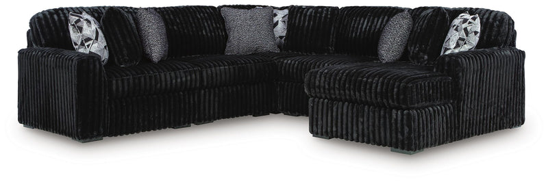 Signature Design by Ashley Midnight-Madness stationary sectional sofa with plush cushions and modern design.