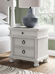 Rowlenstown - Three Drawer Night Stand - R&R Furniture Gallery (Fountain Valley, CA)