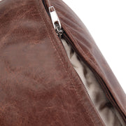Simpli-Home Connor handcrafted round accent pouf with textured fabric, beige color, and plush cushioning for stylish seating.