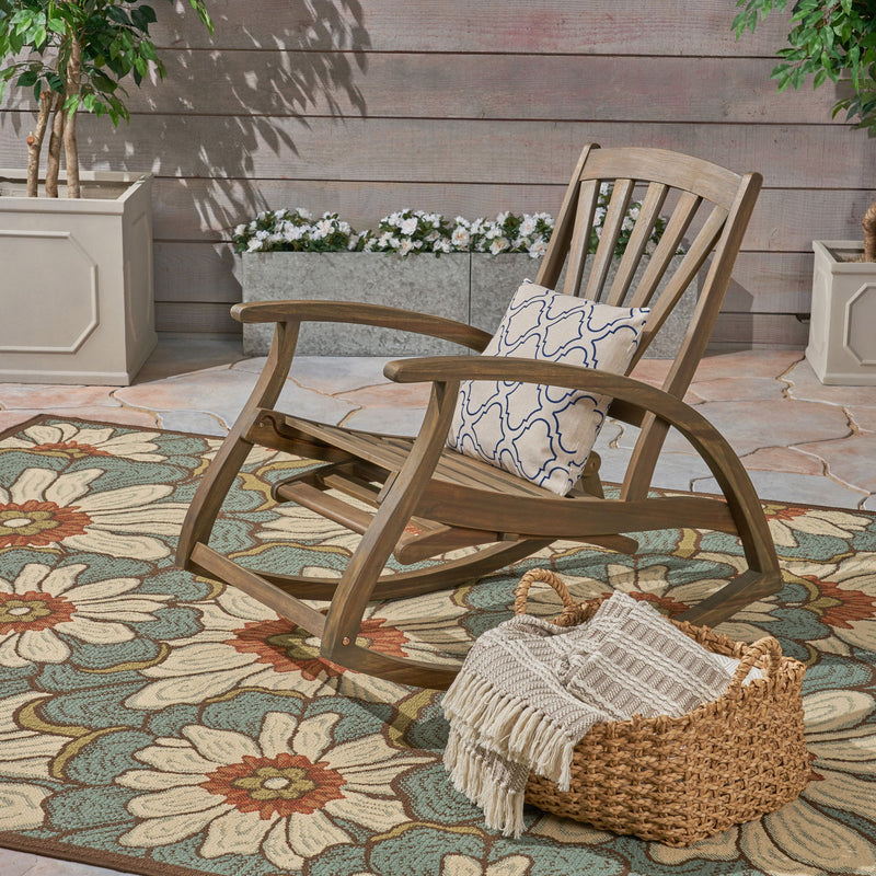 Gray outdoor reclining rocking chair by Noble House, featuring a comfortable design and sturdy frame for outdoor relaxation.