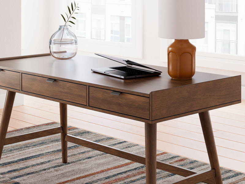 Signature Design by Ashley Lyncott home office desk with a spacious writing surface and modern design.