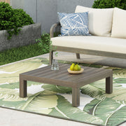 Noble House Oana Brava rustic gray coffee table with slat panel design, showcasing a sturdy wooden surface and modern style.