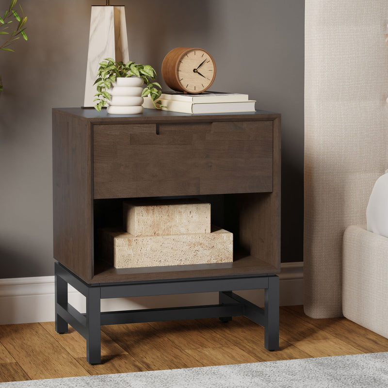 Walnut brown Banting accent nightstand by Simpli-Home with a sleek design and storage drawer, placed next to a bed.