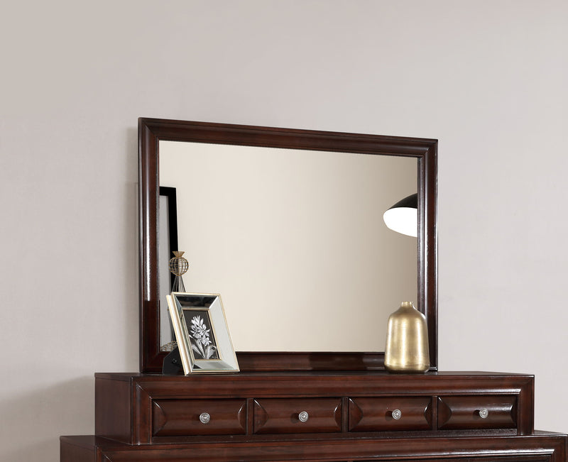 Glory Furniture LaVita mirror with a sleek, modern frame, shown hanging on a wall in a contemporary room setting.