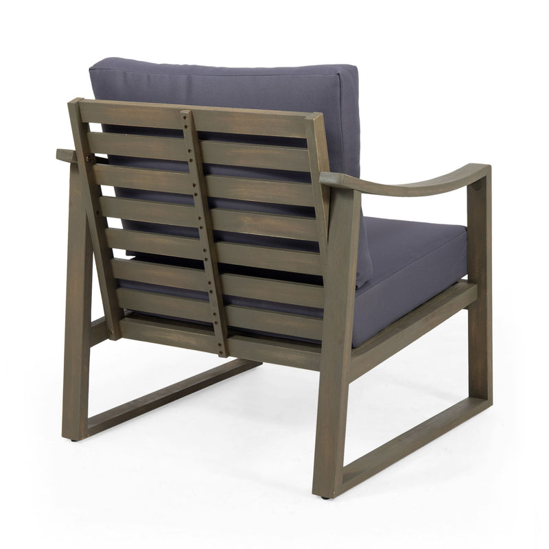 Noble House Samwell outdoor club arm chair with plush cushions and dark wooden frame for patio or garden seating.