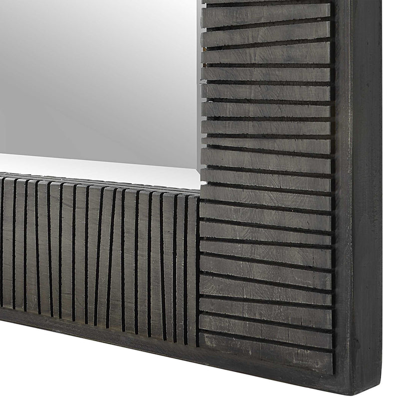 Uttermost Figaro oversized gray accent mirror with a modern, sleek design, hanging on a wall in a contemporary living space.