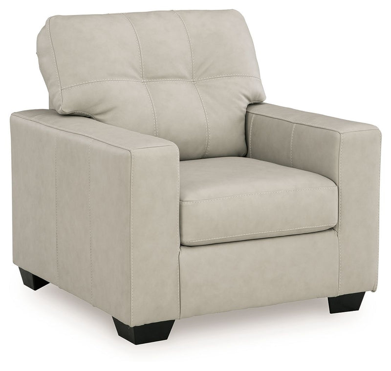 Signature Design by Ashley Santorine living room set with stationary chair and ottoman, featuring plush upholstery and stylish design.