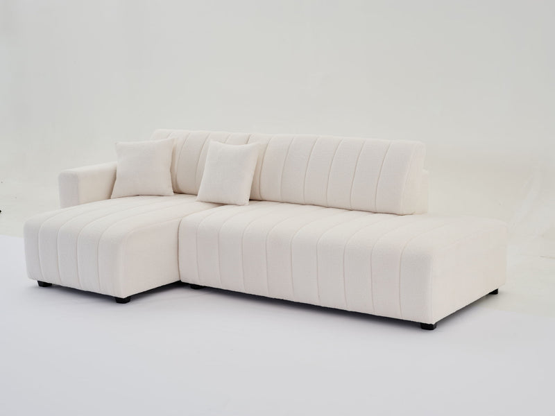Urban Retreats Jessica lamb wool sectional sofa with chaise, showcasing a versatile stationary sectional in a modern living room setting.