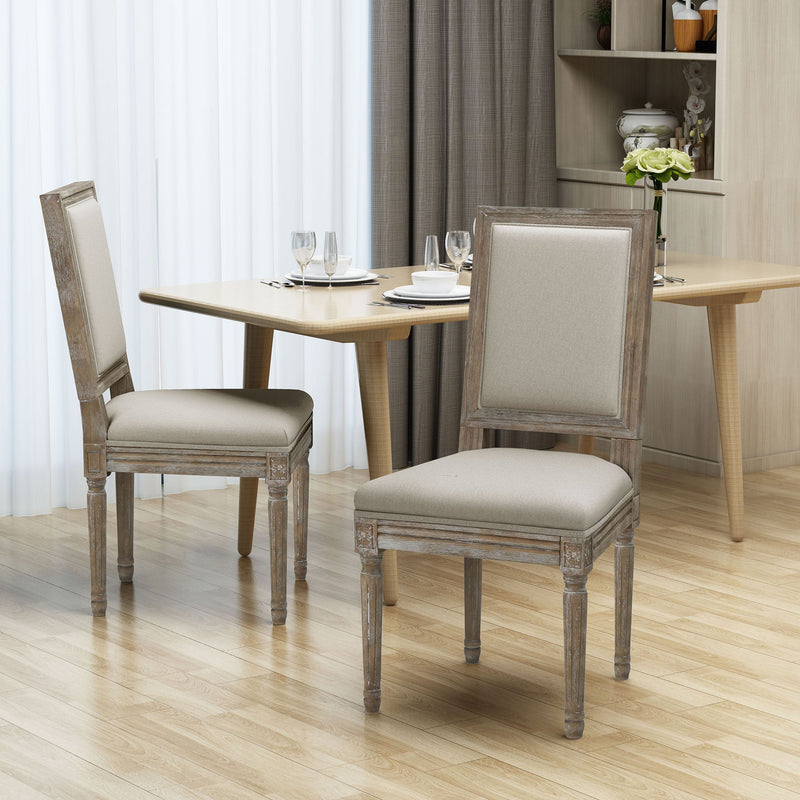 Noble House traditional style dining chair set with fabric upholstery, featuring elegant wooden legs and comfortable cushioned seats.