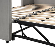 Twin size upholstered daybed with pop-up trundle from Halcyon Home, featuring plush fabric and space-saving design.